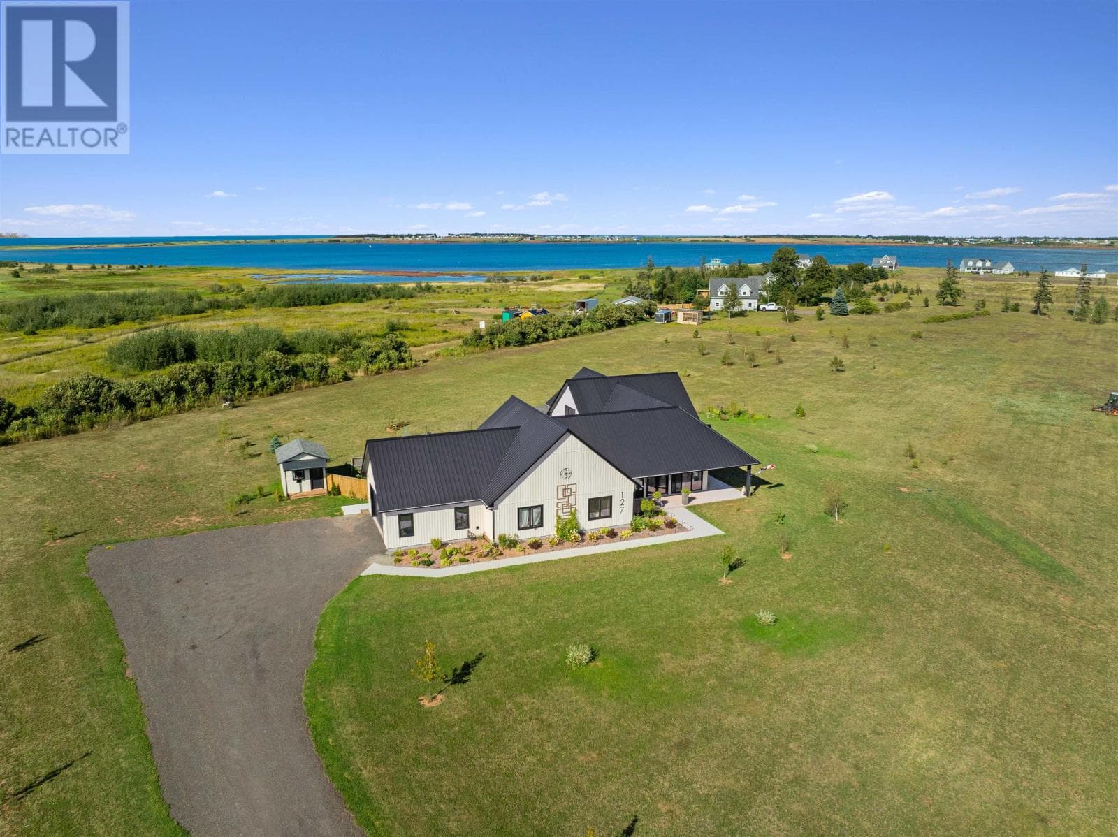 3 bed 3 bath single family at 127 Thompson Shore Road — $997,000