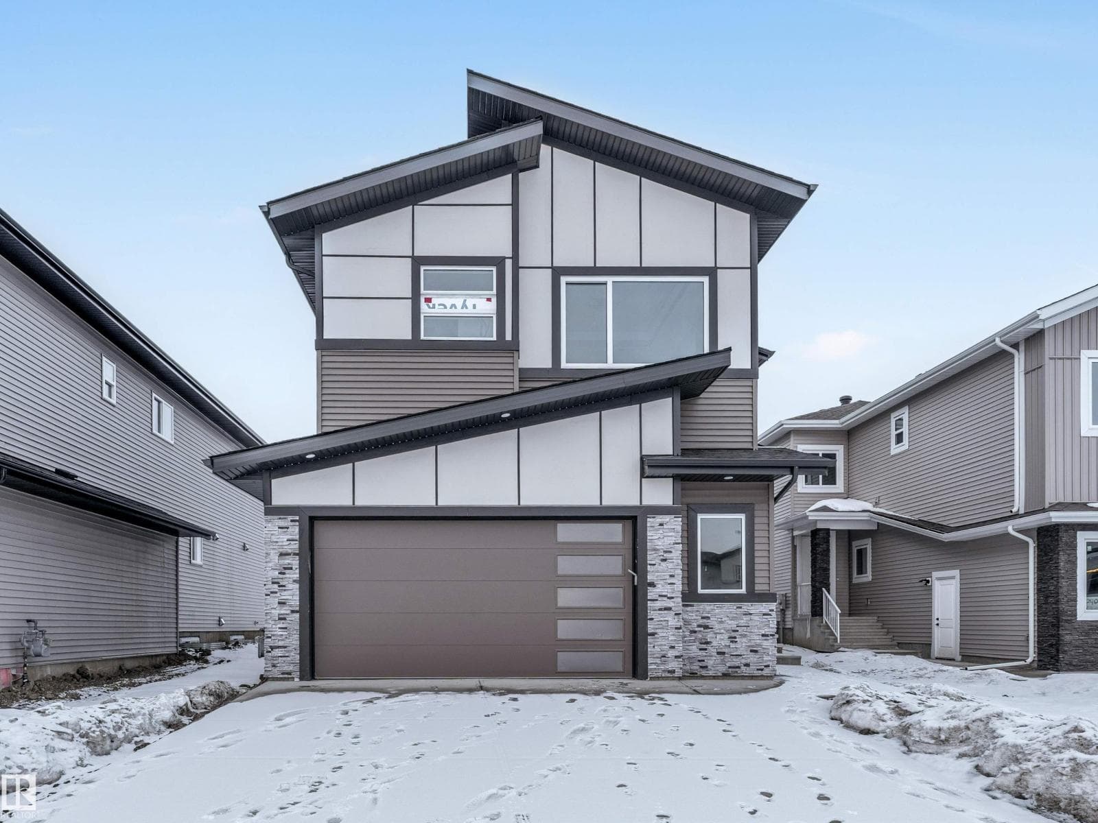5 bed 4 bath single family at 2346 63 AV NE — $774,900