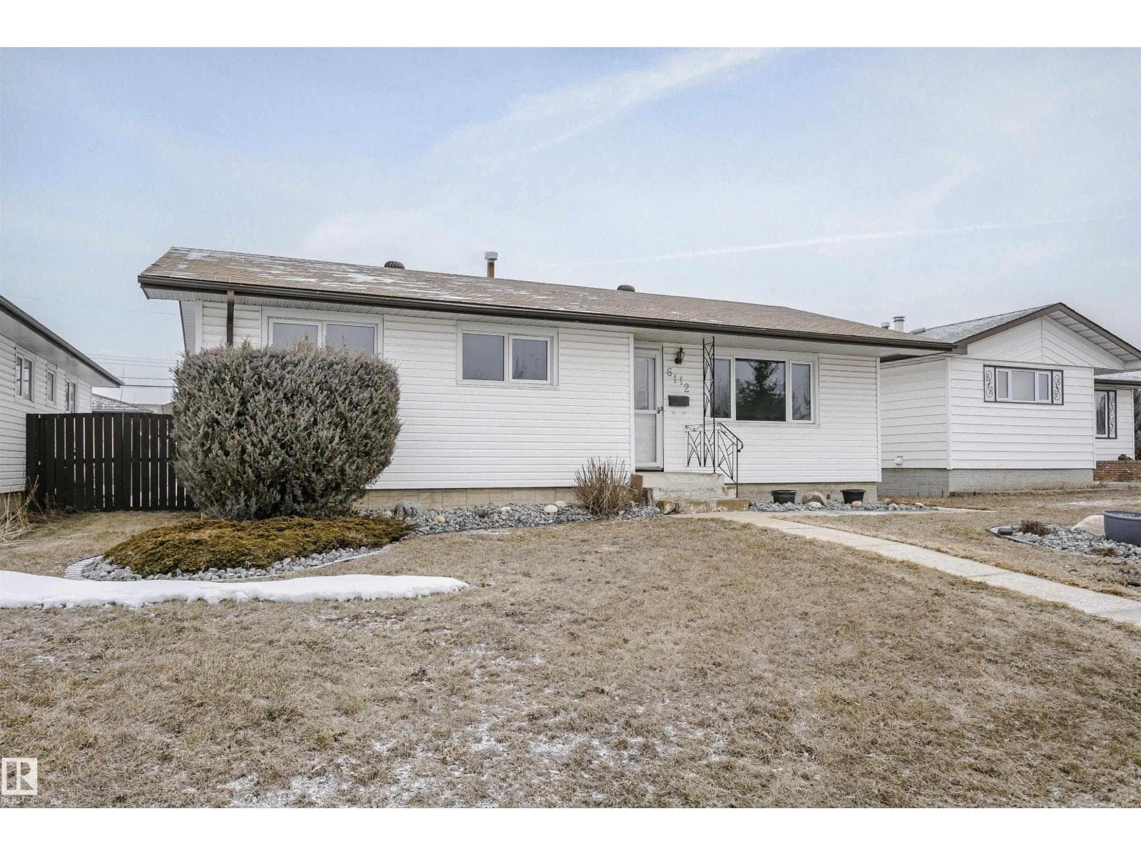 4 bed 2 bath single family at 6112 142 AV NW — $400,000