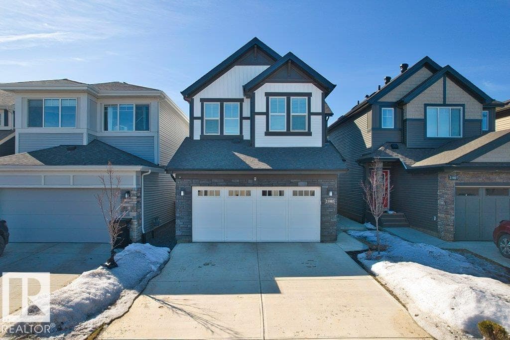 5 bed 4 bath single family at 21003 131 AV NW — $699,000