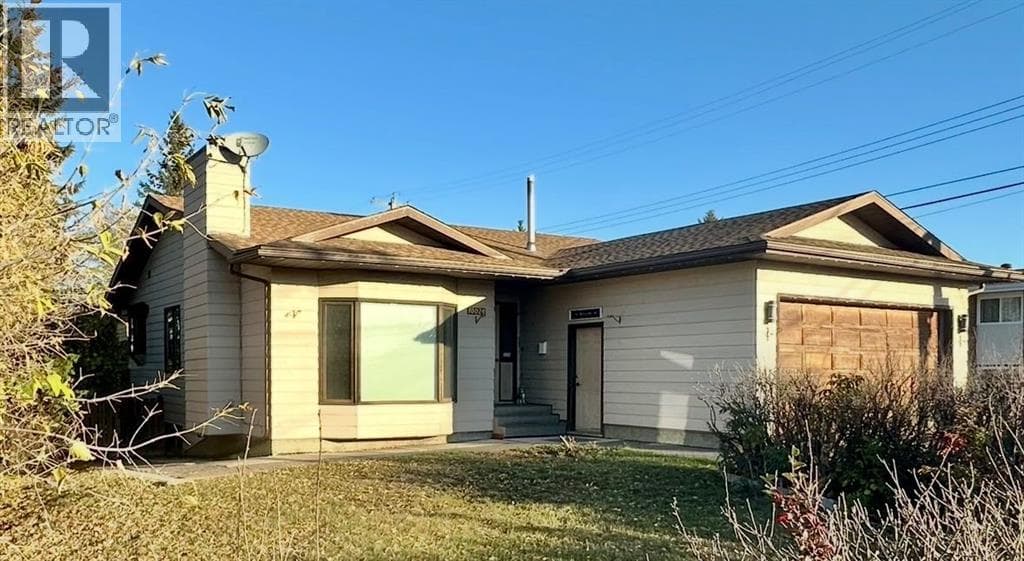 4 bed 3 bath single family at 10024 103 Ave — $399,000