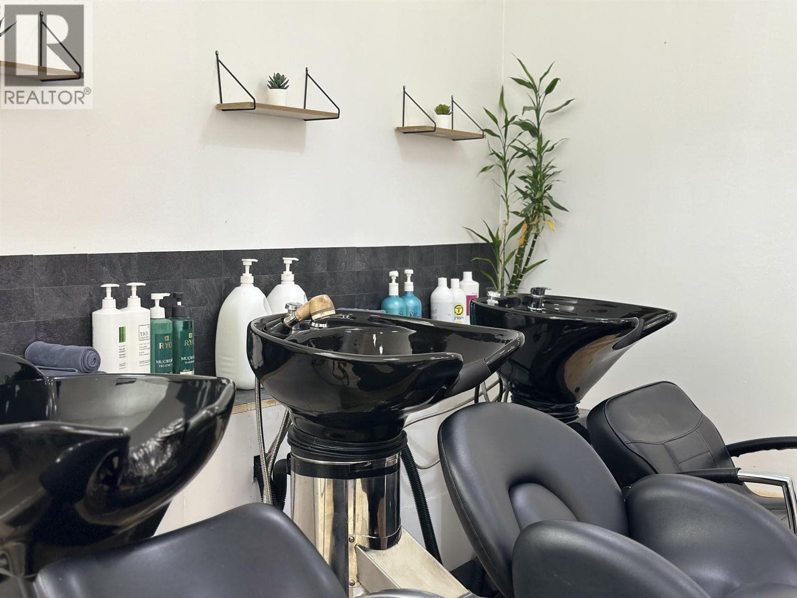 business at 122 W BROADWAY — $150,000