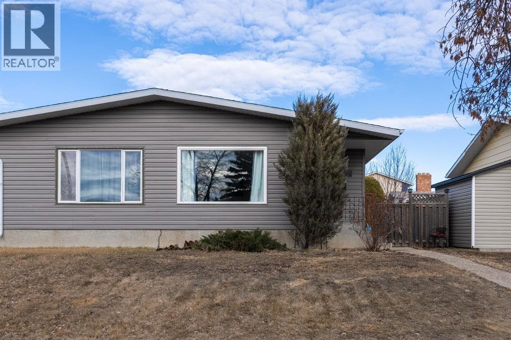 4 bed 2 bath single family at 4303A 65 Street — $274,900