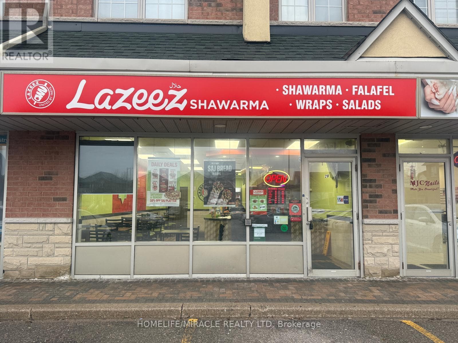 business at 28 - 9699 JANE STREET — $199,000
