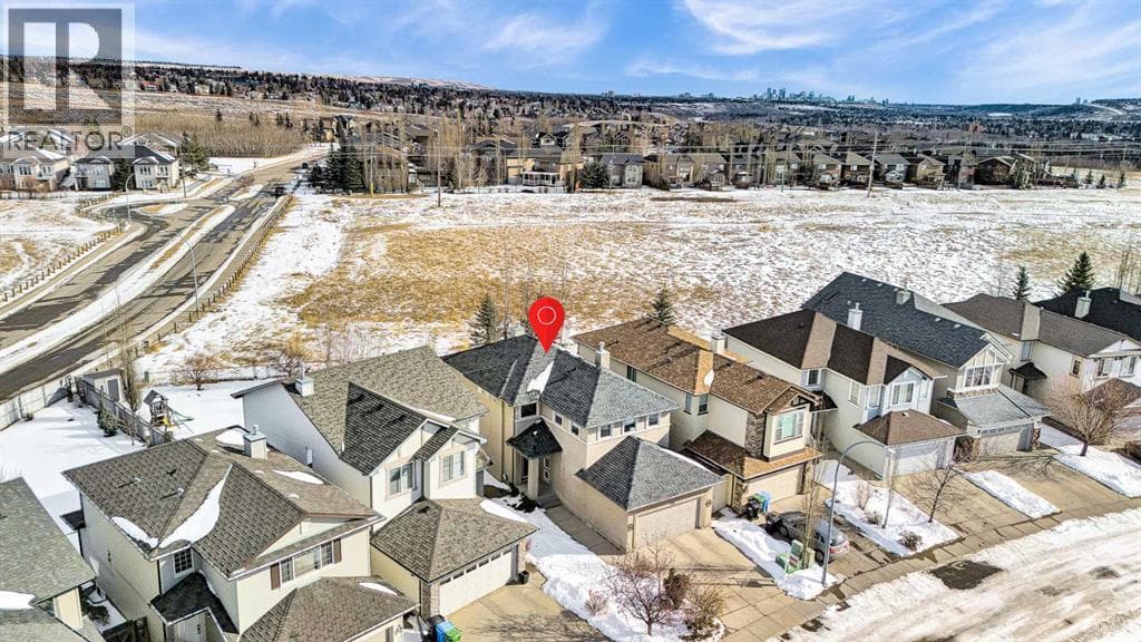 4 bed 4 bath single family at 206 Tuscany Ravine Close NW — $870,000