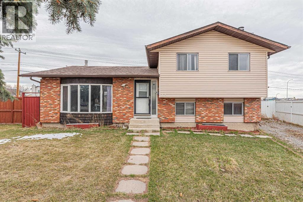 4 bed 3 bath single family at 64 Castledale Crescent NE — $549,900