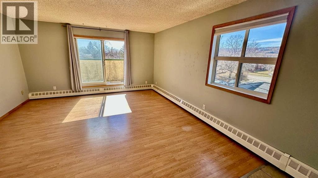 2 bed 1 bath single family at 8, 6203 Bowness Road NW — $225,000