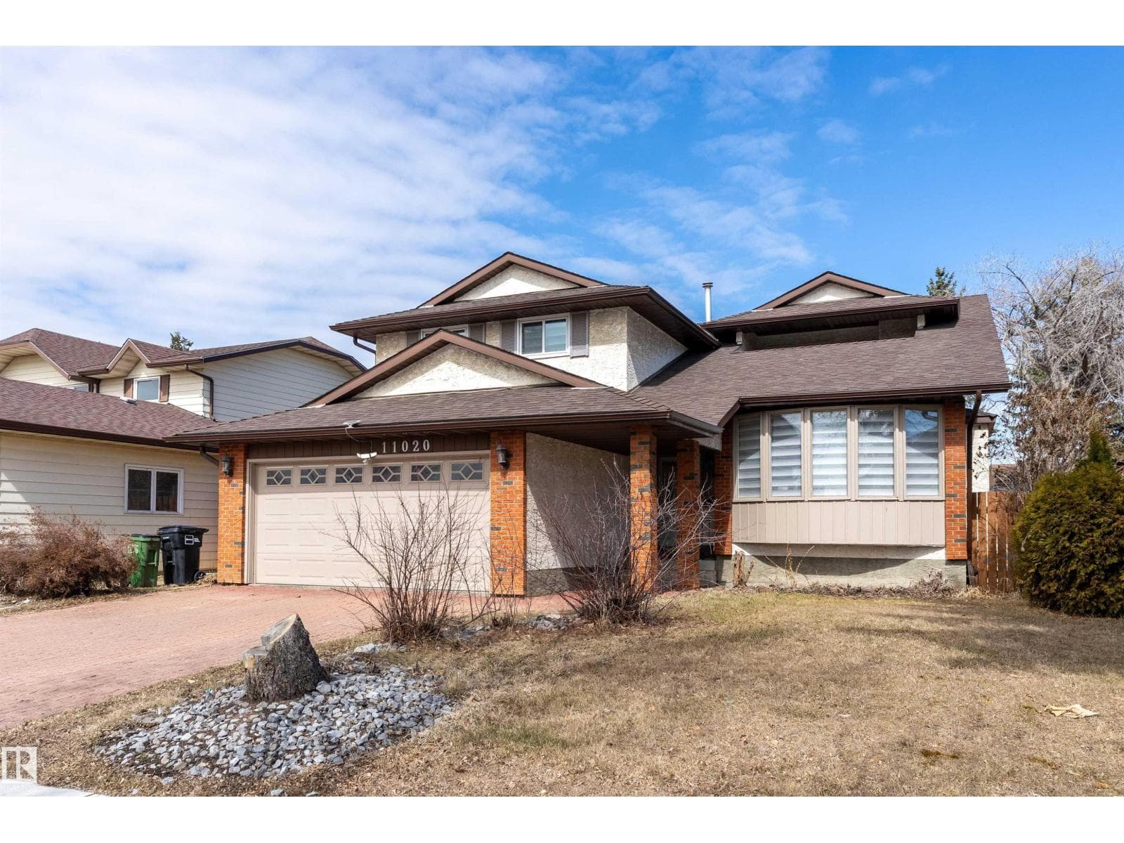 5 bed 4 bath single family at 11020 158 AV NW — $589,000