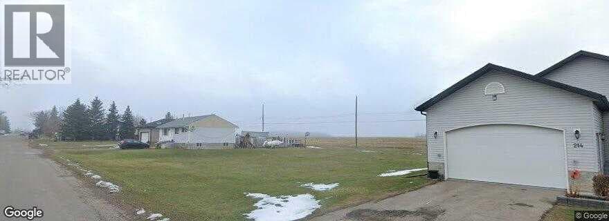 vacant land at 218 9 Avenue — $40,000