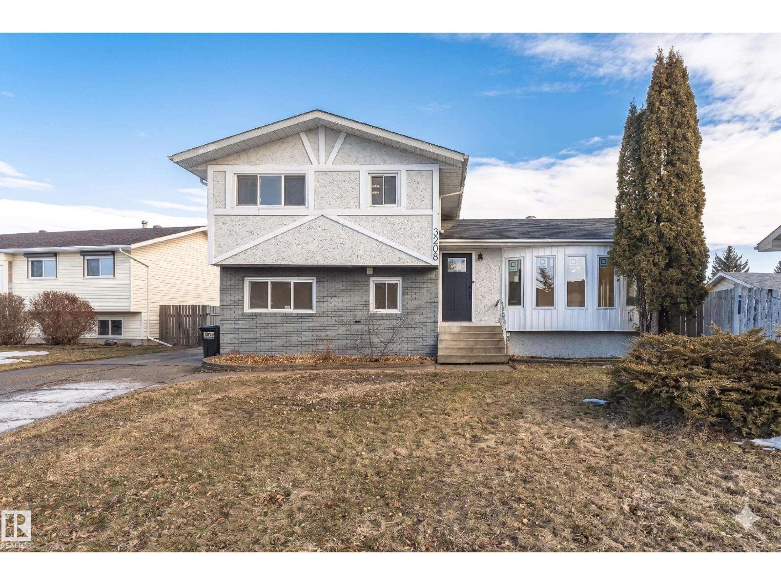 4 bed 3 bath single family at 3208 130 AV NW — $499,990