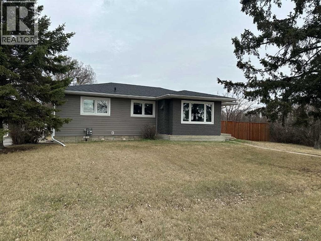 4 bed 2 bath single family at 5002 57 Avenue — $359,000