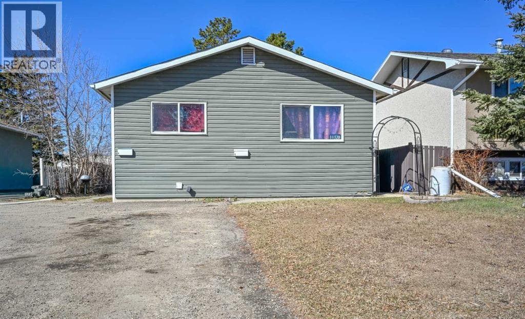 5 bed 2 bath single family at 11320 97 Street — $429,900