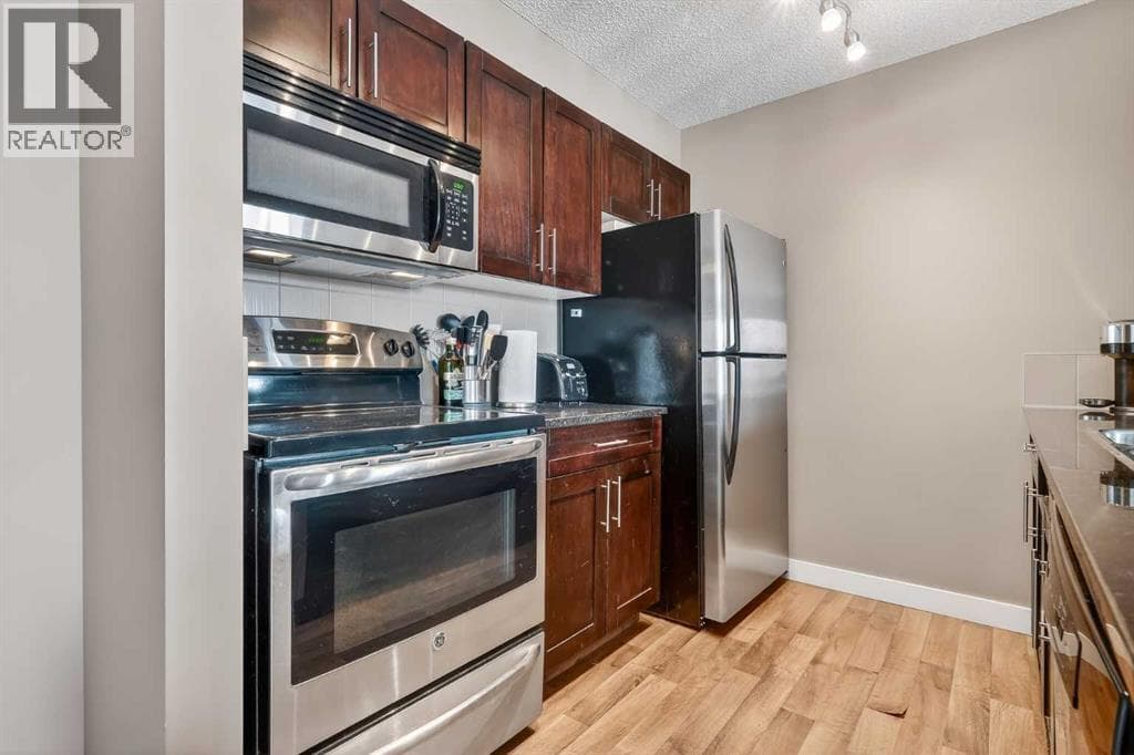 4317, 403 Mackenzie Way SW photo 3