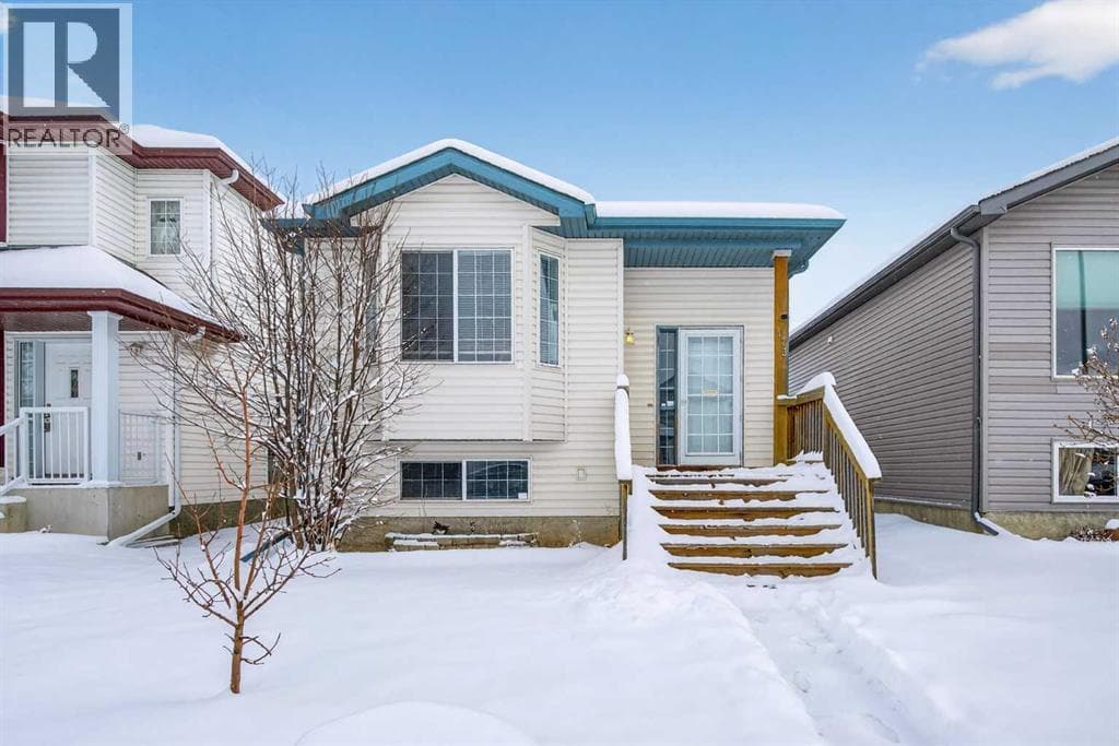 4 bed 2 bath single family at 173 Martin Crossing Crescent NE — $534,900