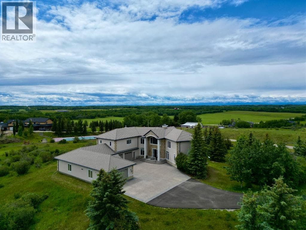 4 bed 6 bath single family at 262060 Range Road 33 — $2,500,000