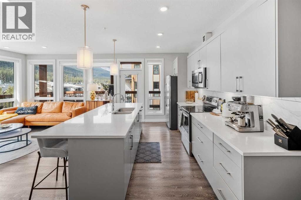 205, 106 Stewart Creek Rise — photo 4