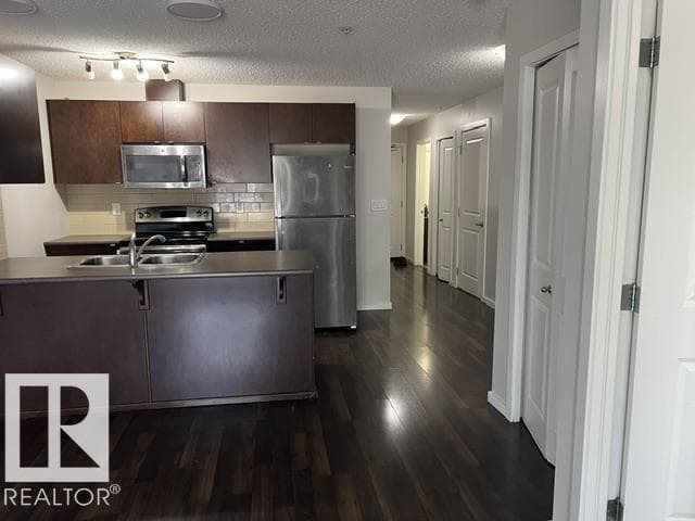#118 3357 16A AV NW — photo 4