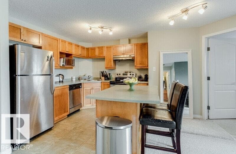 #1213 7339 SOUTH TERWILLEGAR DR NW — photo 2