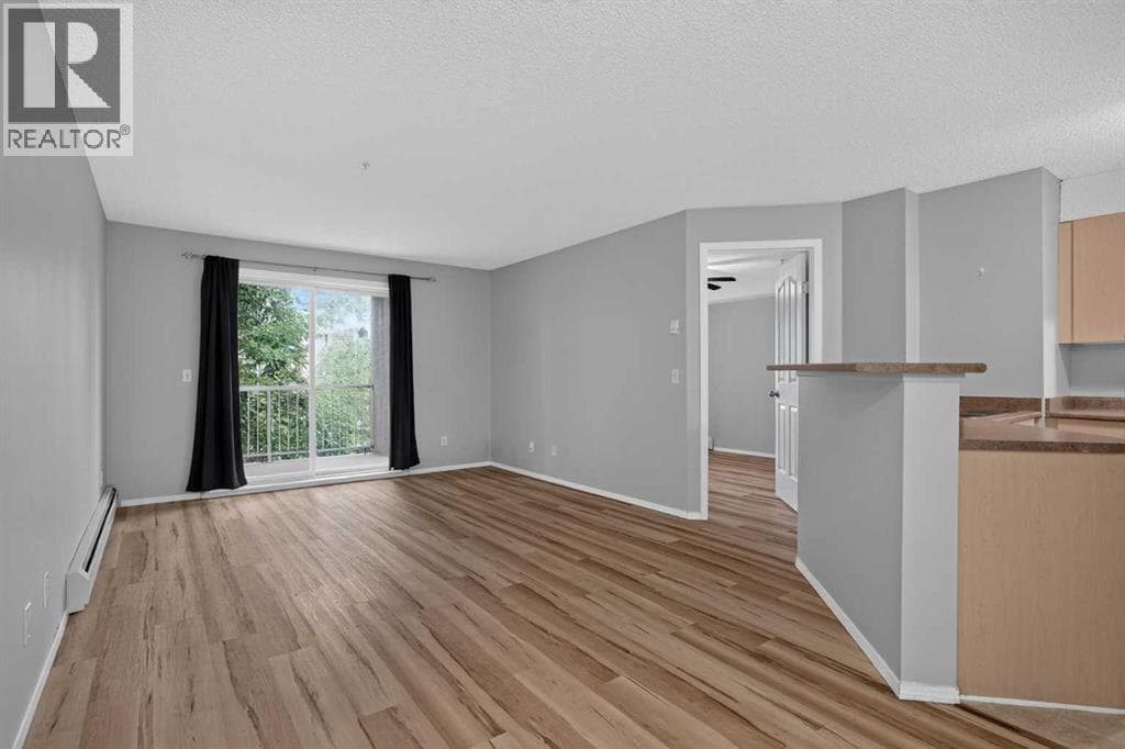 8223, 304 Mackenzie Way SW — photo 4