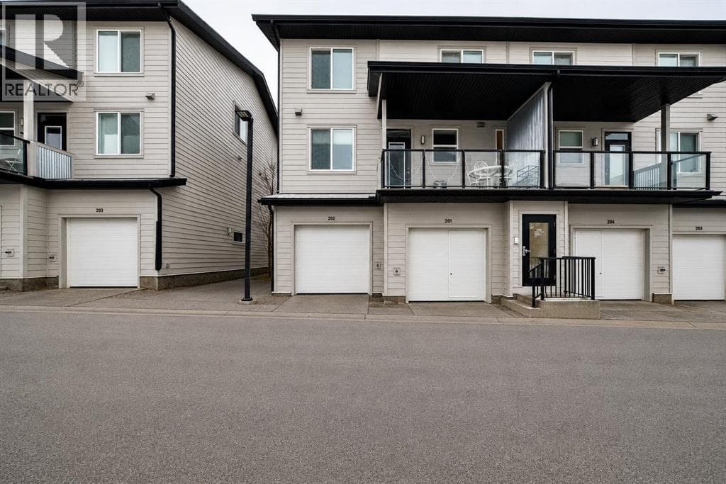 202, 245 Redstone  NE — photo 2