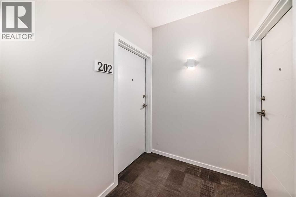 202, 245 Redstone  NE — photo 3