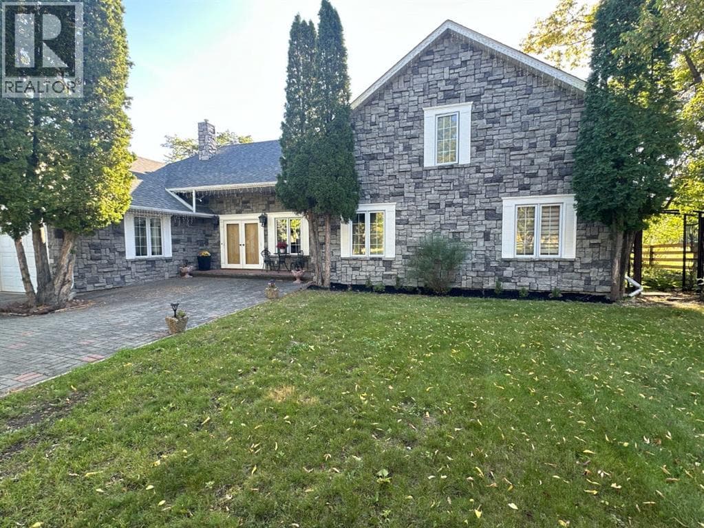 4 bed 3 bath single family at 11905 91 Street — $635,000